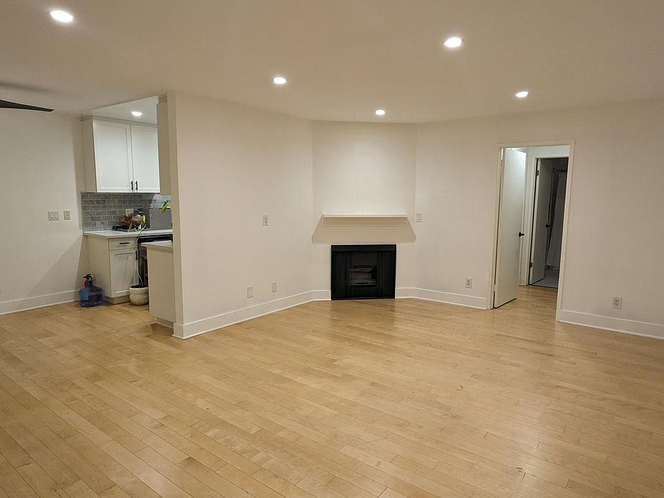 Living room, fire place, utility closet. Bamboo floors. Recessed dimmable lighting throughout.