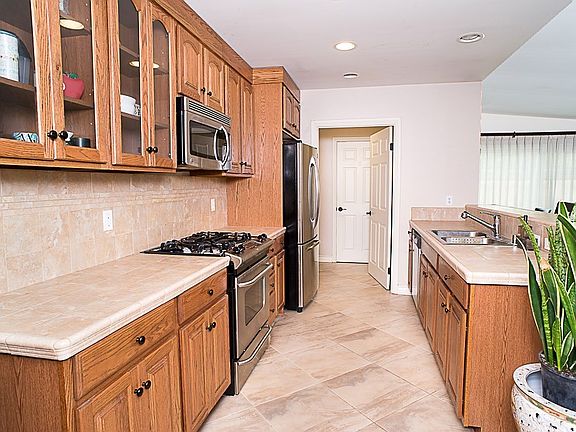 The beautifully remodeled kitchen opens to the fam