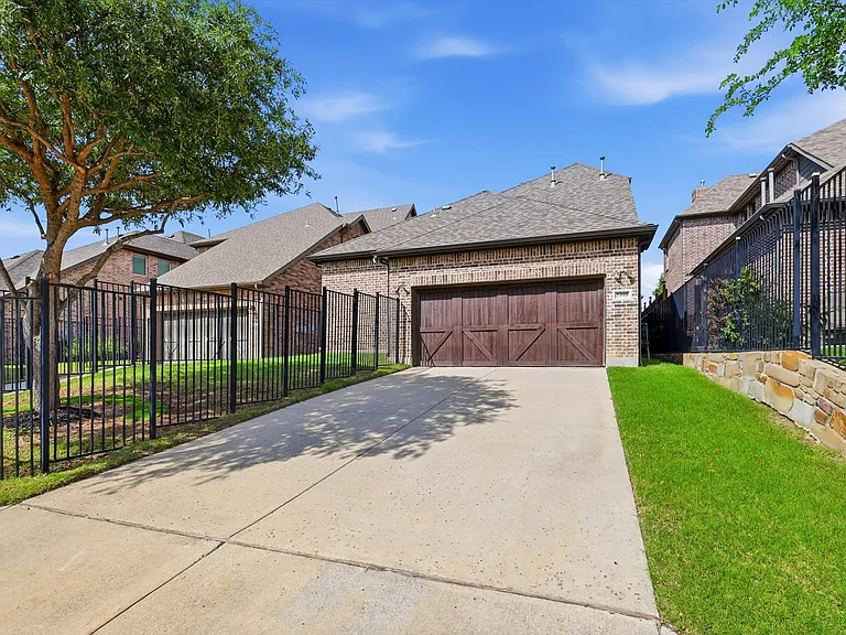 This property features a private, rear-entry two-car garage