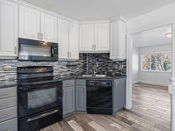 Granite countertops, dishwasher, and electric range. Lots of cabinet space.