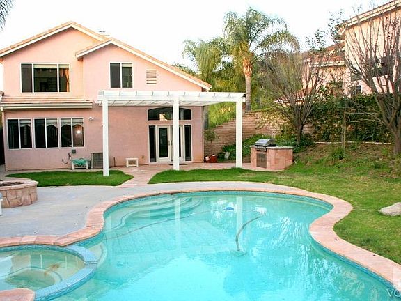 Large back yard with pool & spa