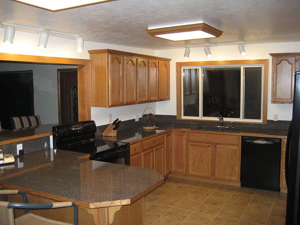 Kitchen opens up to Living/Dining Room with Fireplace