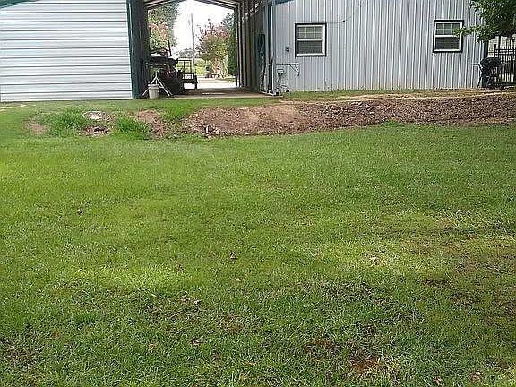 Back of garage and carports.