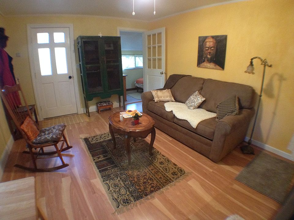 View from kitchenette to bedroom and entrance door