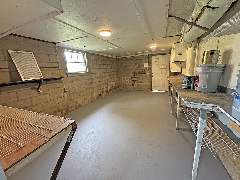 Another Large Storage Area with Door to Side Entry Driveway