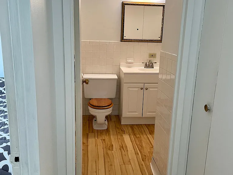 New floors extended to the bathroom for a warm feeling during the cold winter days. Full size bathtub. Linen closet right by the bathroom door.