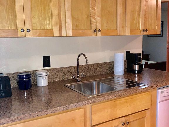 Counter top with 4c. coffee pot, canisters, dishwasher, sink