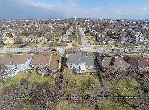 Interior Lot, Professionally landscaped with fence and Newer Trex Decking with added Pergola for shade. Laundry Room has own door to yard.