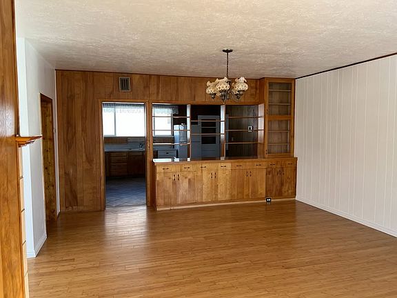 Dining Room with built-in cabinets and shelves