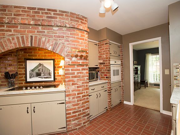 Kitchen is open to the Formal Dining Room and includes full Pantry.