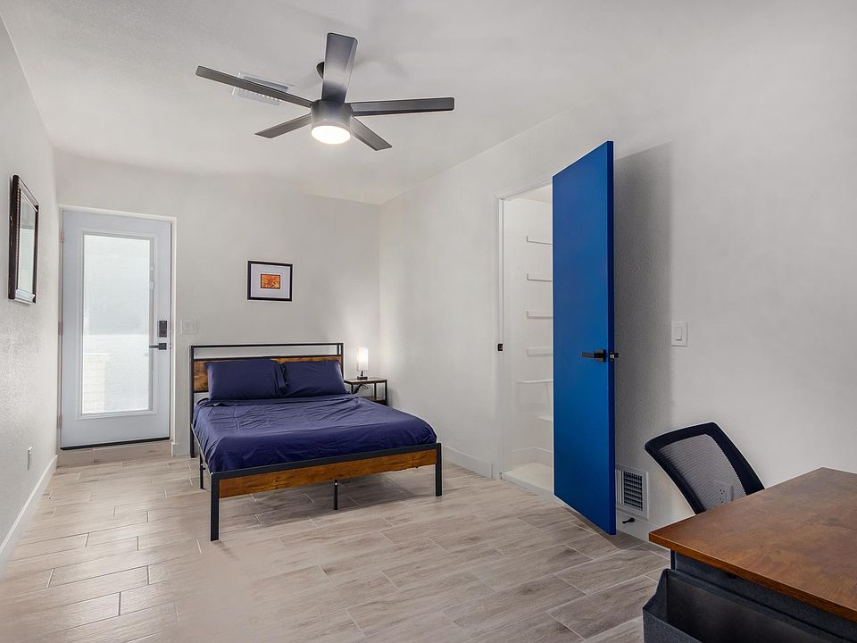 Awesome private door-access to the driveway with a digital lock. Enjoy a large closet with shelves and workspace corner.