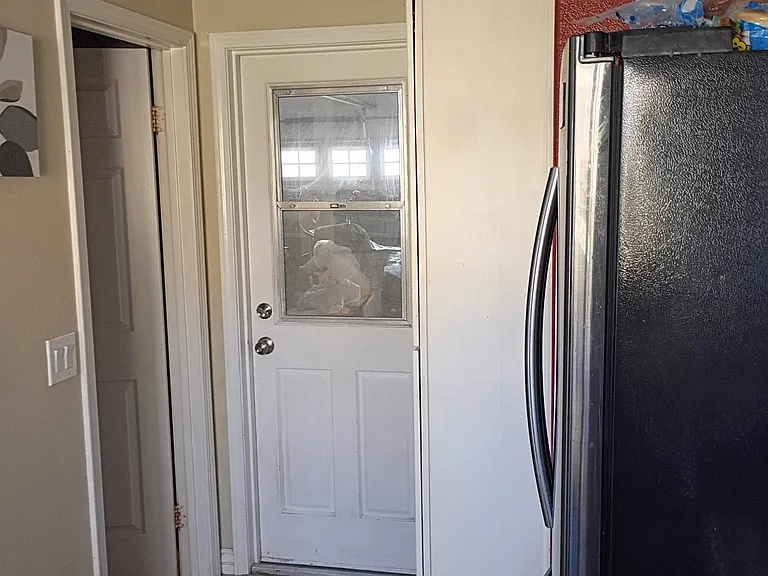 Kitchen Pantry/Garage Door/Half Bathroom Entrance