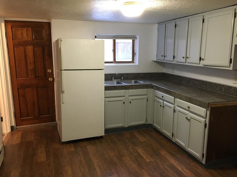 Spacious kitchen with tile countertops, new floor, freshly p