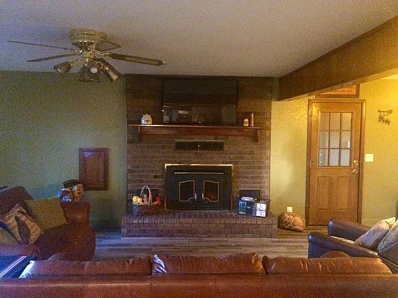Family Room from Kitchen
						:
						Cozy room. The TV stays. Door on right leads to small entry hallway by garage.
