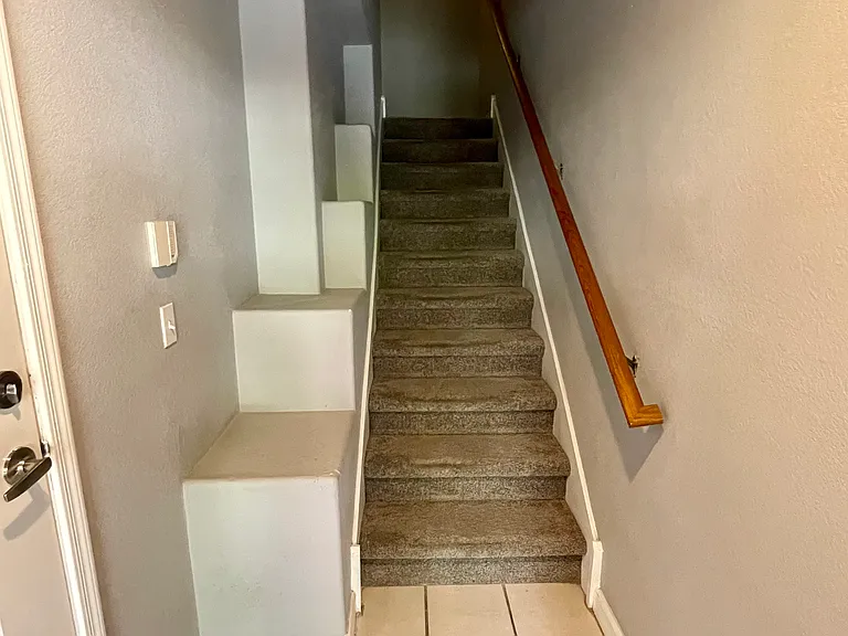 Staircase up from front entry on 1st floor