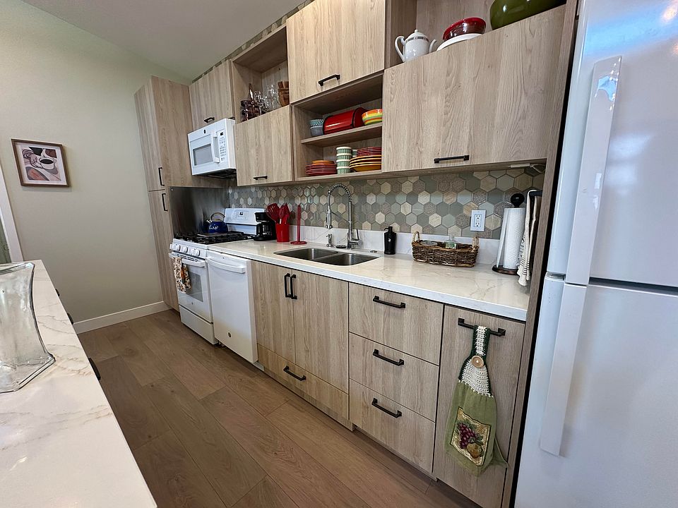 Kitchen with full-sized appliances, including dishwasher