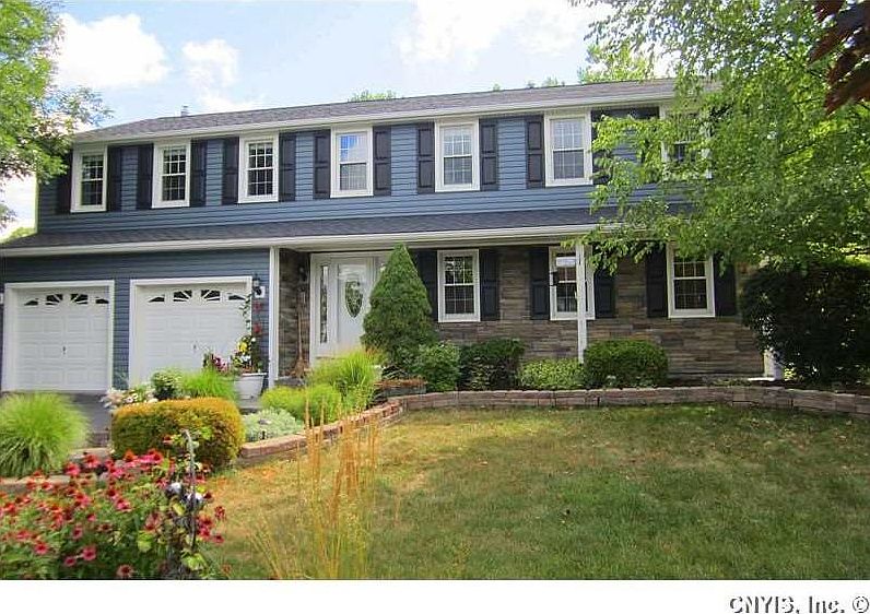 Exterior Front. Talk about "great curb appeal"!  NEW top-of-the-line vinyl siding with stone accent, all new windows, new roof, and new exterior doors - all graced by lovely perennial gardens all around.