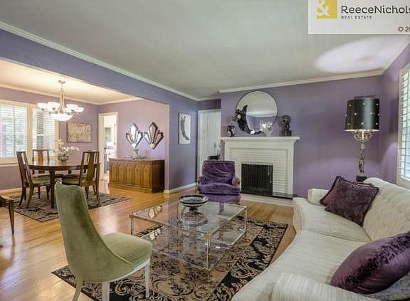 Spacious formal living room with plantation shutters.