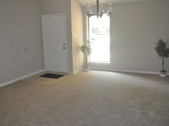 This is the front room. Could be a dining room or a living room.
