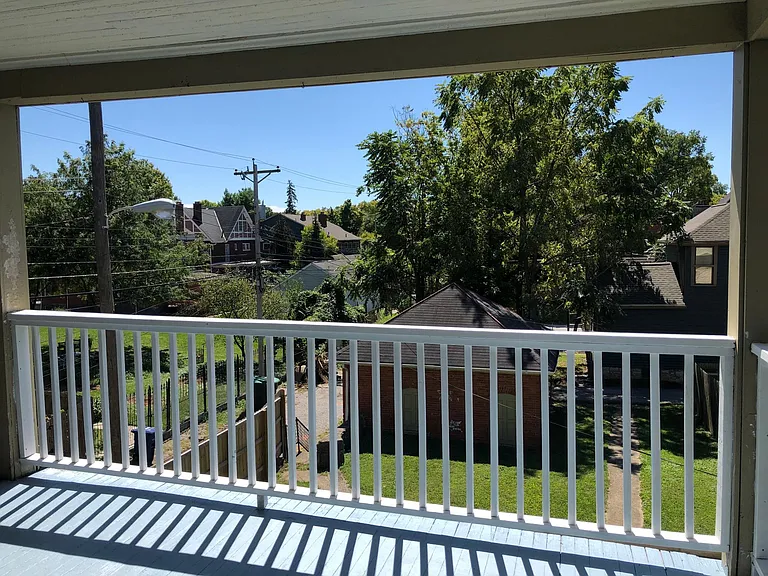 Covered Balcony with ceiling fan for morning coffee and relaxing