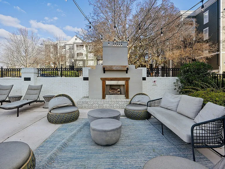Fireplace with seating in Haven at Birkdale Village
