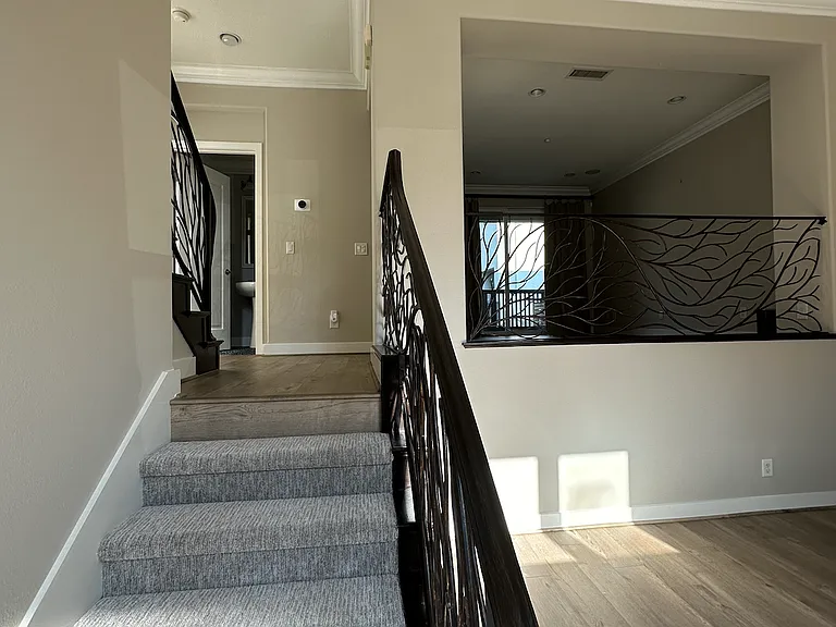 Half flight of stairs to dining & kitchen area, plus half bath/powder room