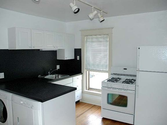 Kitchen with oven, fridge and Washer and Dryer.