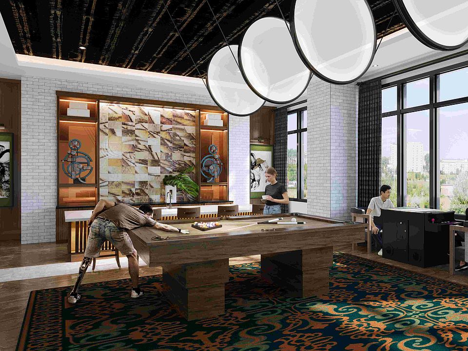 An inviting game lounge designed for play and relaxation, with pool, arcade entertainment, and stylish interiors.