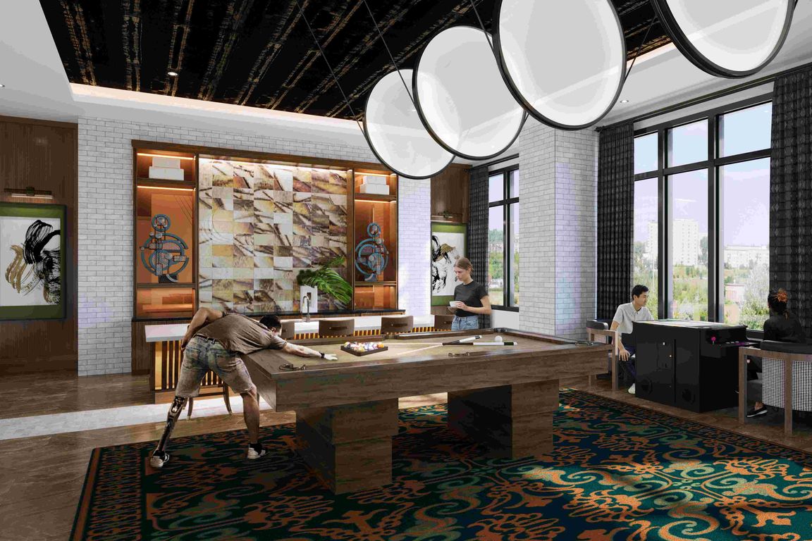 An inviting game lounge designed for play and relaxation, with pool, arcade entertainment, and stylish interiors.