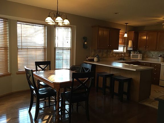 Open Dining area to the kitchen with a breakfast bar.