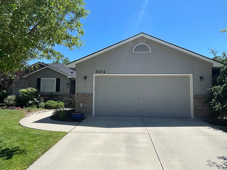 Two car garage with driveway parking