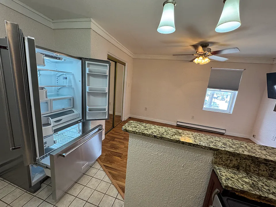 Kitchen looking into LR (French Door refrigerator on the left)