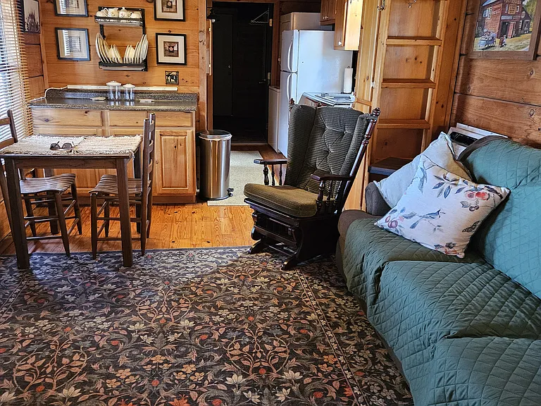 Living area - view from Bedroom. Additional storage located in loft area.