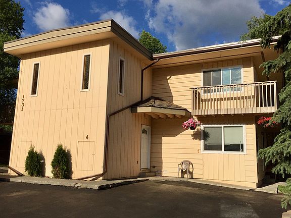 Summer Photo of 4-Plex with Hanging Flower Baskets