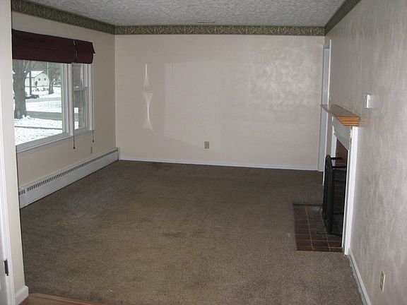 Wood Fireplace
						:
						Spacious living room with wood fireplace