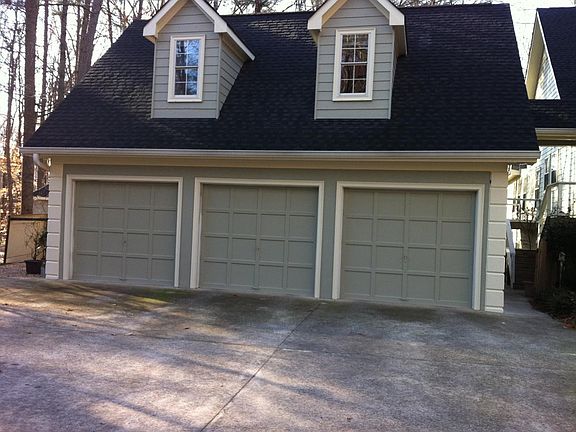 View of the garage with apt above entrance to the apt is in
