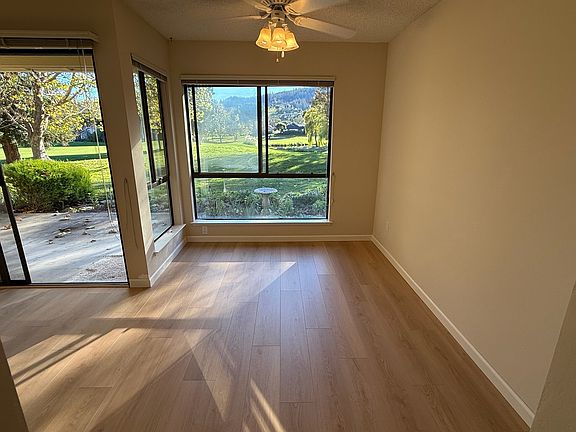 Breakfast nook and patio door, switched adjustible fan and light, classic base on new wood look floor