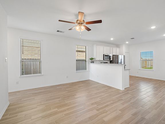 The open concept living room and kitchen makes for a great way to keep the party going and never miss a beat