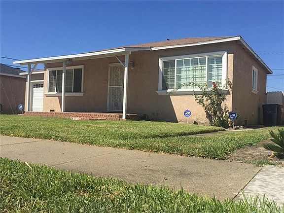Right side of home showing another side entrance to backyard