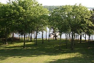 Beautiful backyard sloping down to boat dock
