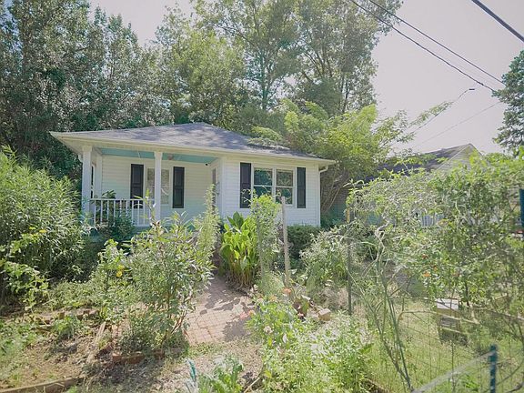 Front of the house from the garden. All kinds of fruits and veggies, herbs and flowers, grow here
