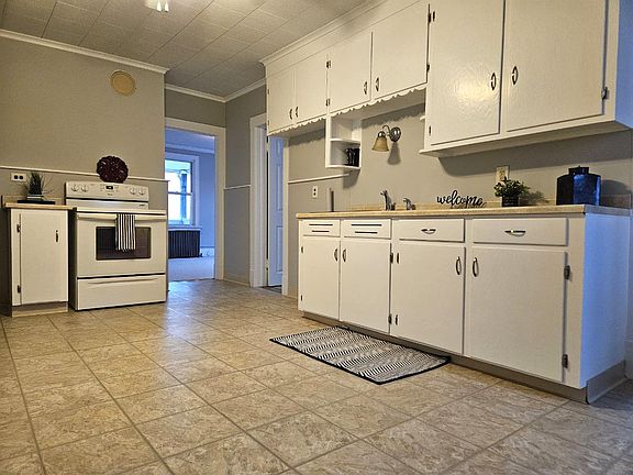 Spacious Kitchen with crisp white cabinets.