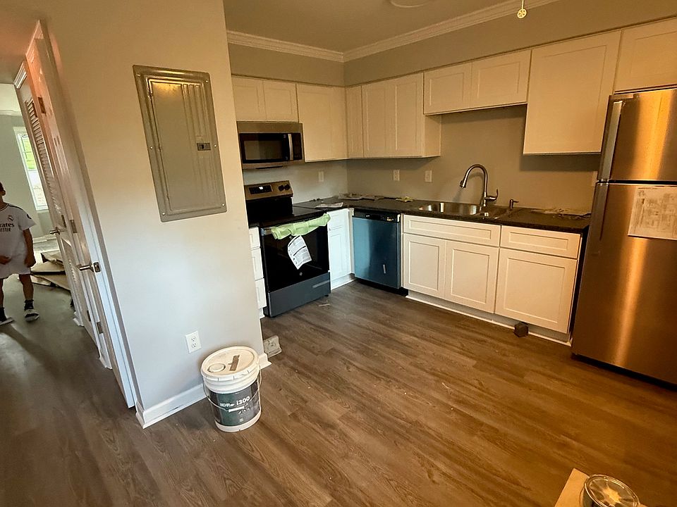 Large kitchen with eat in space. Large and everything is new. SS appliances. Granite counters. New cabinets, flooring, and pain. Walk out onto your main floor deck overlooking the back yard and green area.