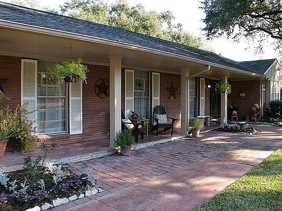 A gracious front porch adds some southern charm.