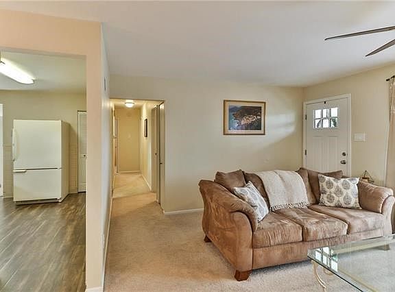 View of kitchen and hallway to bedrooms from living room.