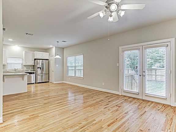Wood floors throughout the open first floor living area with tons of natural light!