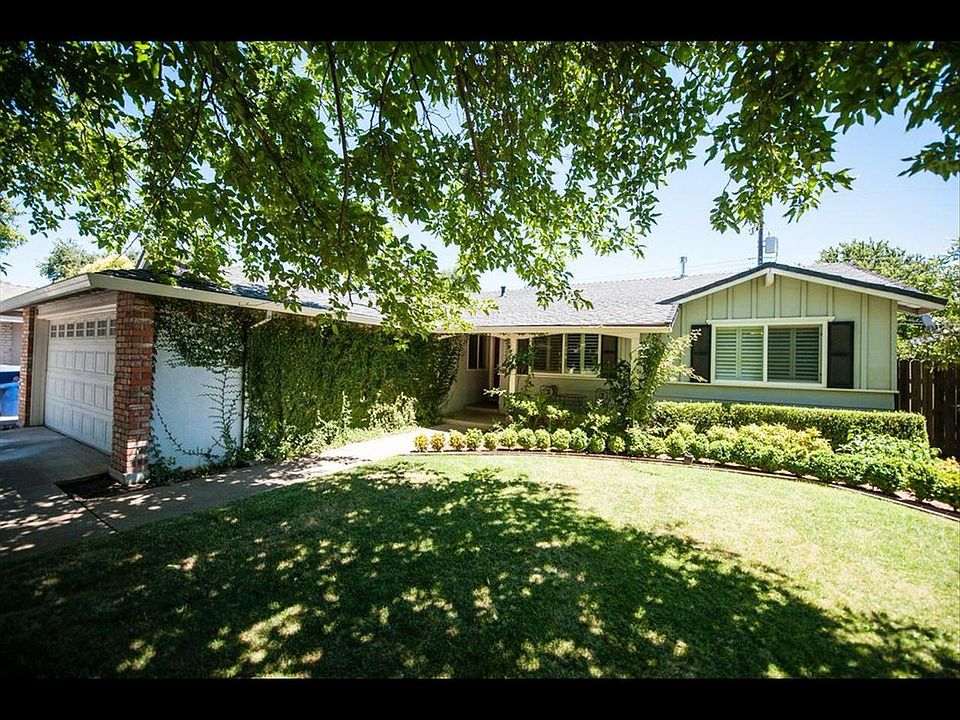 Beautifully shaded home on quiet Naples Street.