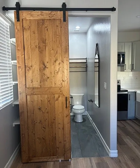 Barnyard door to bathroom opened