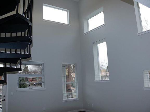 Tons of light & windows, high ceilings, balcony/patio area