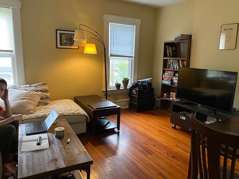 Large living room on second floor with hardwood floors